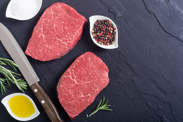 Raw beef steak with rosemary