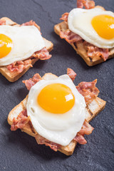 toast with bacon and fried eggs