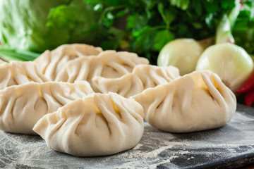 Fototapeta na wymiar Raw gyoza or jiaozi dumplings ready for cooking