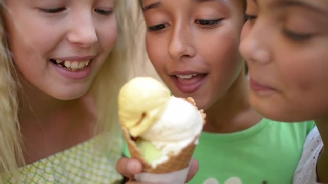 Three funny Girls eat fruity Plomber Ice cream Cone