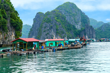Floating fishing village and rock island in Lan Ha Bay destination beautiful sea and the beach in Vietnam, Southeast Asia. UNESCO World Heritage Site. © pomphotothailand