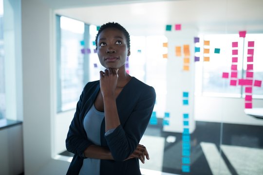 Female executive standing in office