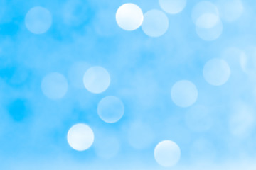 White blue bokeh light abstract background texture. Christmas pattern bokah, wallpaper.