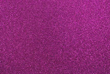 Pink glitter background, shiny sparkling glitter particles creating a beautiful texture, glistering fuchsia purple-colored backdrop for website or marketing