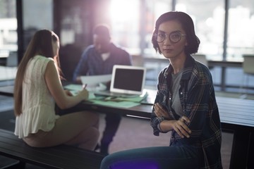 Female executive sitting in office