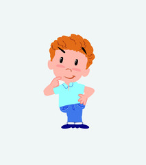 Blond boy in jeans thoughtful and happy.