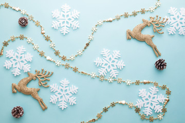 Merry Christmas and Happy New Year. Pattern foam cutter snowflake and dried pine on pastel color