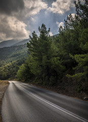 road in the mountain with clowdy sky