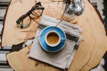 Delicious fresh morning espresso coffee with a breautiful crema in a blue demitasse cup with a...