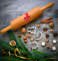 Christmas gingerbread with decoration on a wooden board. Top view.