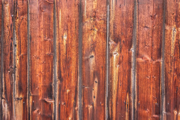 Vertically tiled stained wood wall texture background