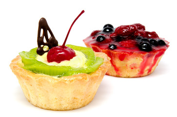Delicious cakes pastry with fruit raspberry currant kiwi isolated