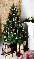 Background of christmas fir tree and gift boxes in christmas time