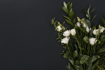 top view of bouquet with eustoma flowers over black background