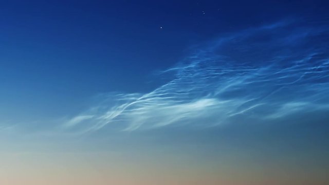noctilucent clouds NLC in summer morning twilight timelapse ZOOM IN