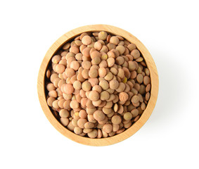 lentils in wood bowl on white background. with clipping path