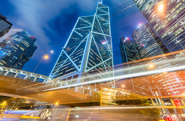 Central skyscrapers with road car light trails at night, Hong Kong