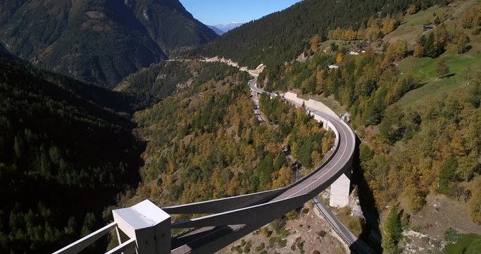 Alpine road, Cinema 4k aerial view over cars on a mountain road, between mountains, on a sunny fall day, on simplon pass, in wallis, of the alps in Switzerland
