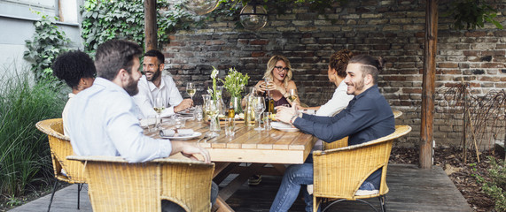 Friends Having Lunch Together at Restaurant