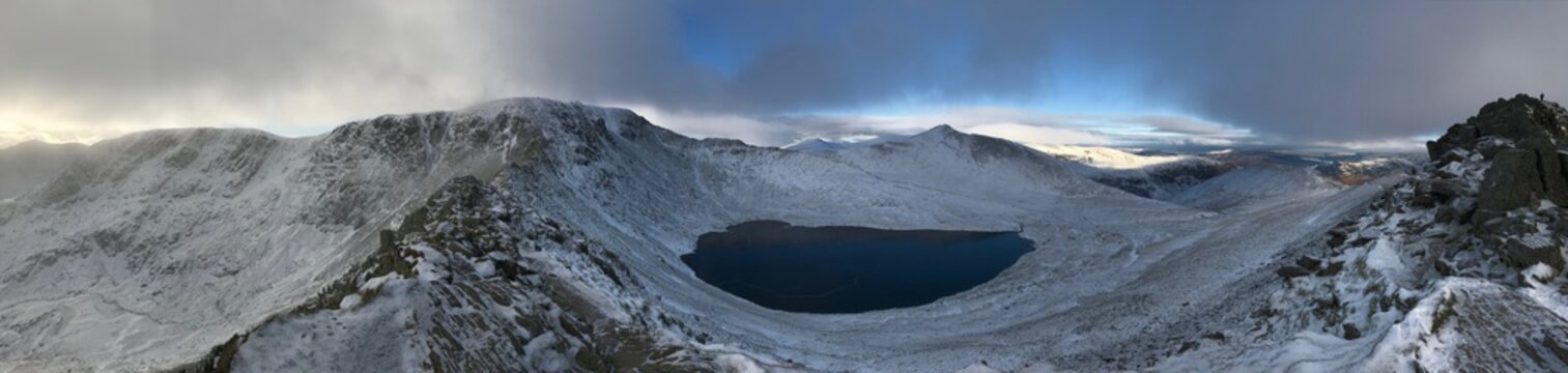 Panoramic of Helvellyn with Striding edge down the centre. On a snowy winters day