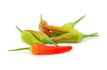 Heap of green Chili peppers isolated on white background