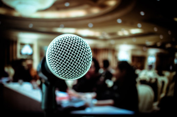 Microphones on front stage in seminar room, for talking speech in conference hall light with...