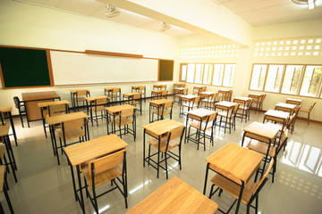 Lecture room or School empty classroom with desks and chair iron wood in high school thailand, interior of