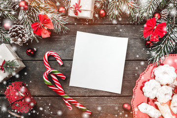 Christmas theme with fir branches, cones, red bows and globes, present boxes and candies, cookies,...