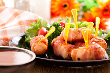 Fried sausages and vegetables with sauce.