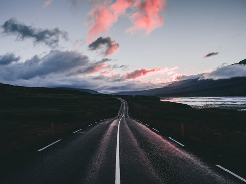 Landscape With Beautiful Sunset With Clouds And Road In Iceland