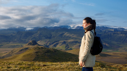 Attractive girl Hiker on background of mountain landscape