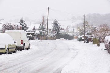 Heavy snowfall on a housing estate in the United Kingdom  with roads blocked by snow and ice