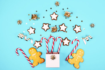 Christmas composition with gingerbread man in a pink box.