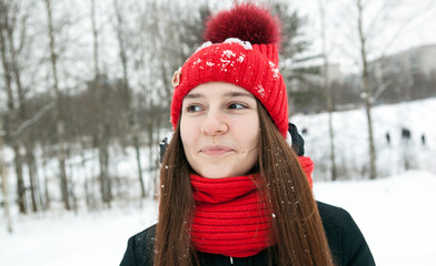 one girl in winter clothes is smiling