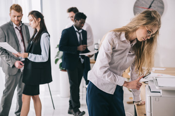 group of young businesspeople working together at office