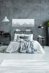 Geometric poster in man's bedroom