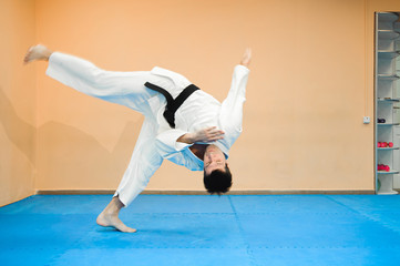 Man fighting at Aikido training in martial arts school