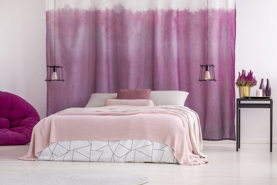 King-size bed with pink bedding