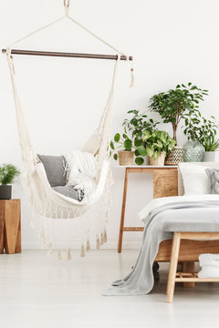 Beige hammock in bright bedroom