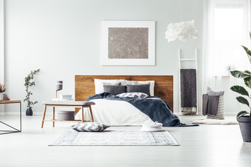 Grey painting in spacious bedroom