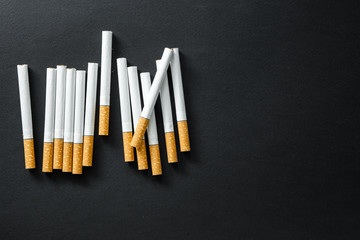 Cigarettes on a dark background.