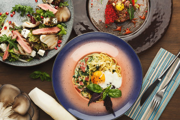 Assortment of tasty restaurant dishes, top view