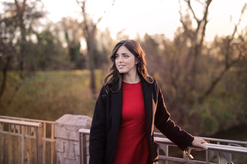 Beautiful woman taking a picture at the park