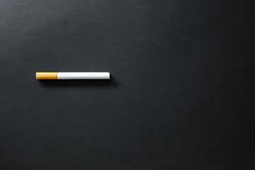 Cigarettes on a dark background.