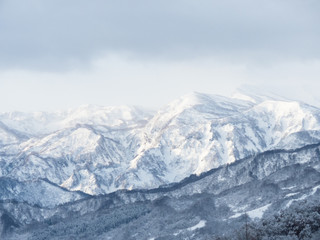 Fototapeta na wymiar 雪山の風景「妙高戸隠連山」