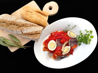 tray with peppers salad and kitchen board with bread