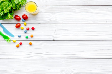 Preparing breakfast with vegetables for children. White wooden background top view copyspace