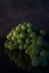 green grapes bunch with reflection