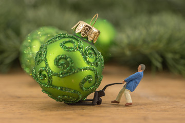 Miniature of storeman and christmas balls - obrazy, fototapety, plakaty