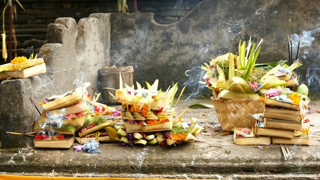 Offering bowls and incense at Tirta Empul Temple, Bali